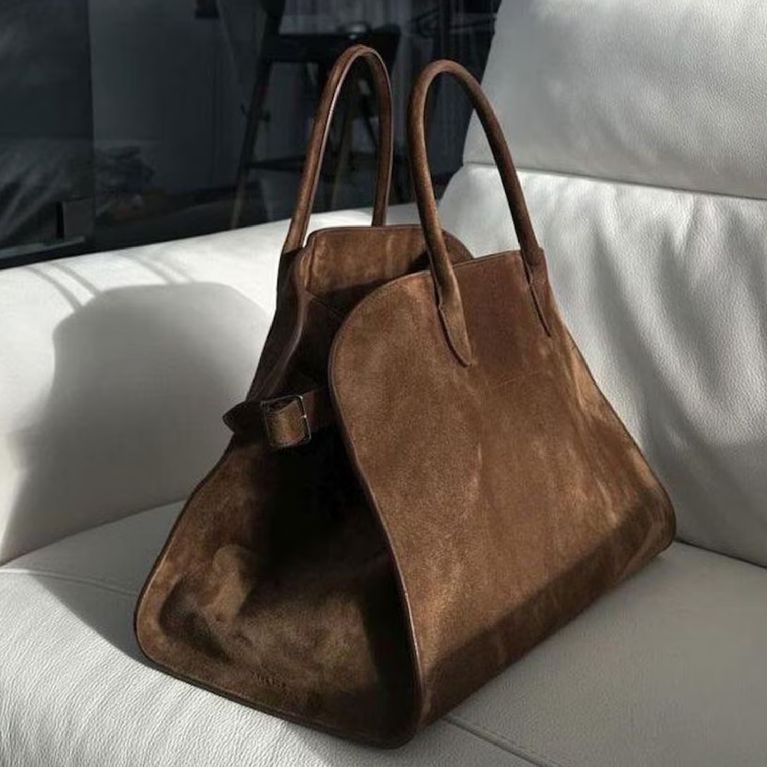 Warm Brown Matte Suede Structured Trapezoid Tote With Curved Matching Top Grips And Golden Buckle Adjustable Side Strap