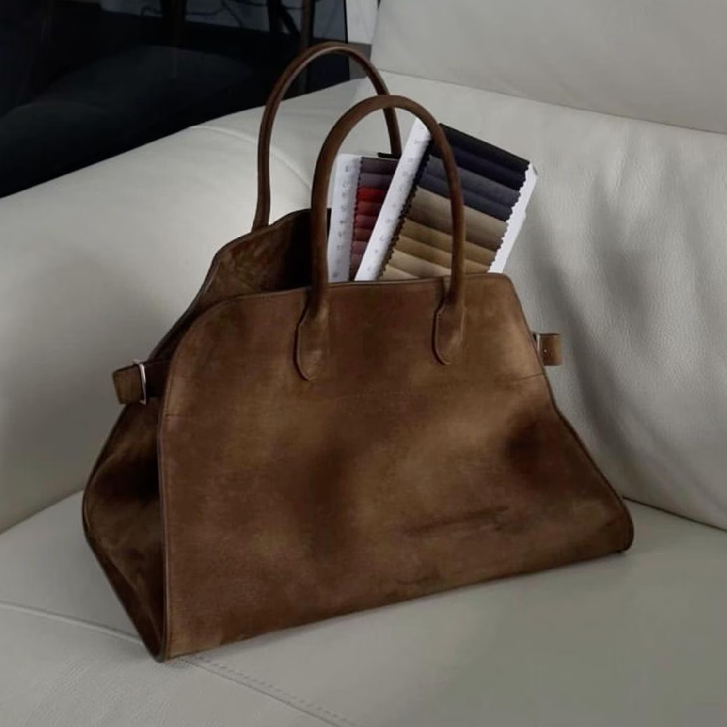 Warm Brown Matte Suede Structured Trapezoid Tote With Curved Matching Top Grips And Golden Buckle Adjustable Side Strap