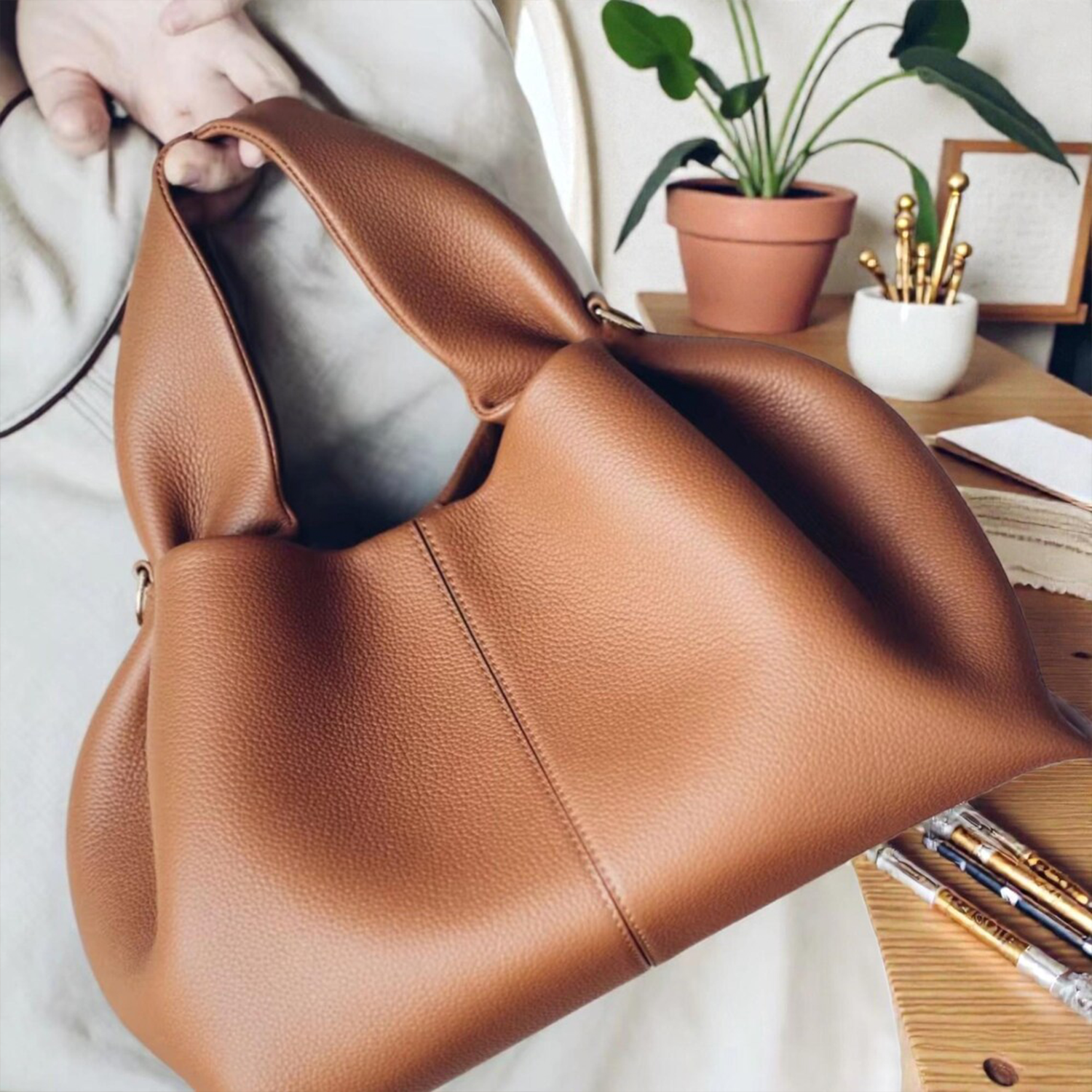 Multi-Tone Soft Grain Draped Dumpling Shoulder Bag With Integrated Looped Top Grips And Polished Golden Side Ring Hardware
